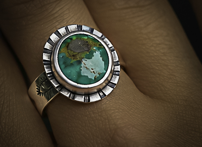 Handmade silver ring set with green turquoise