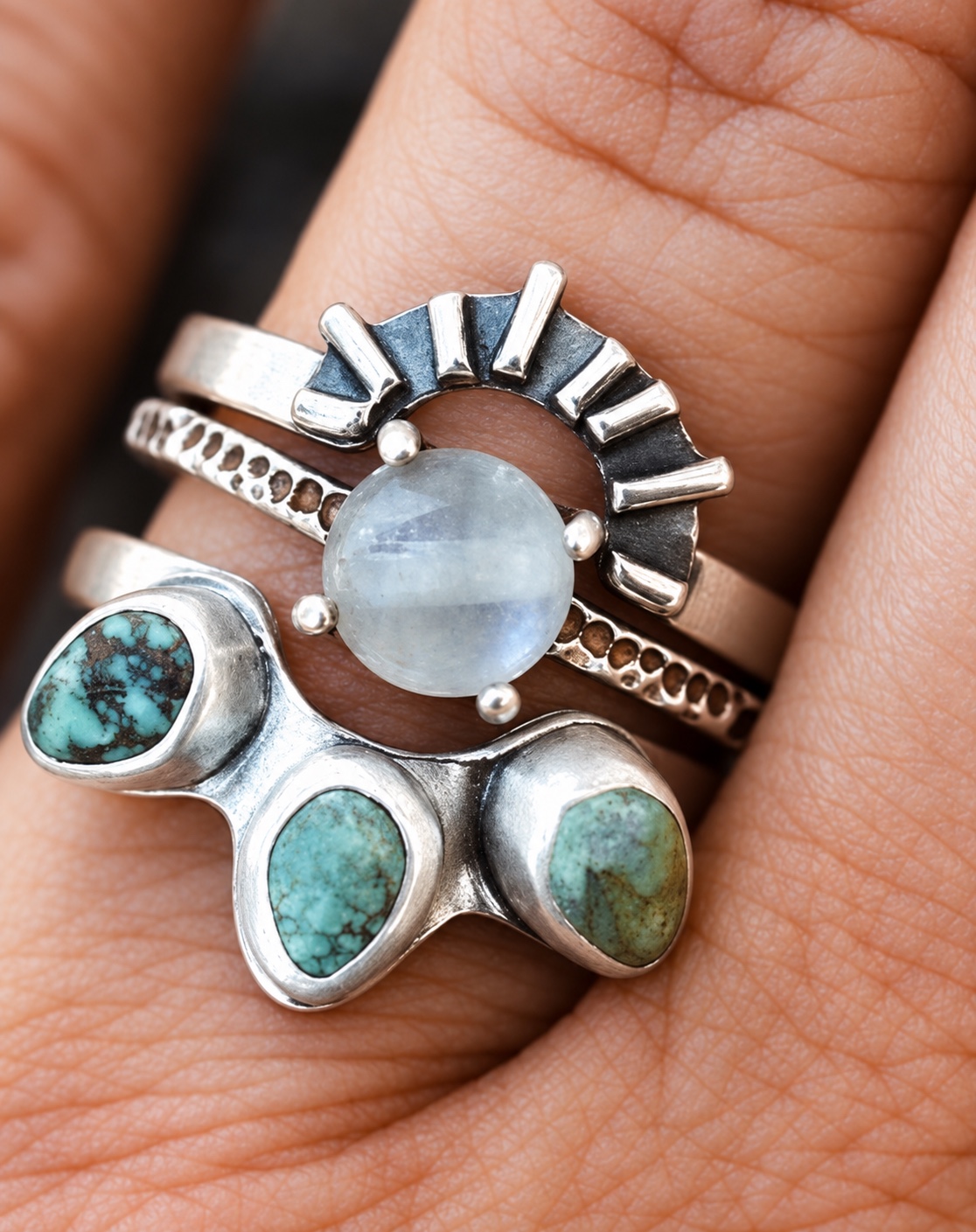 Collection of handmade textured silver rings set with natural stones