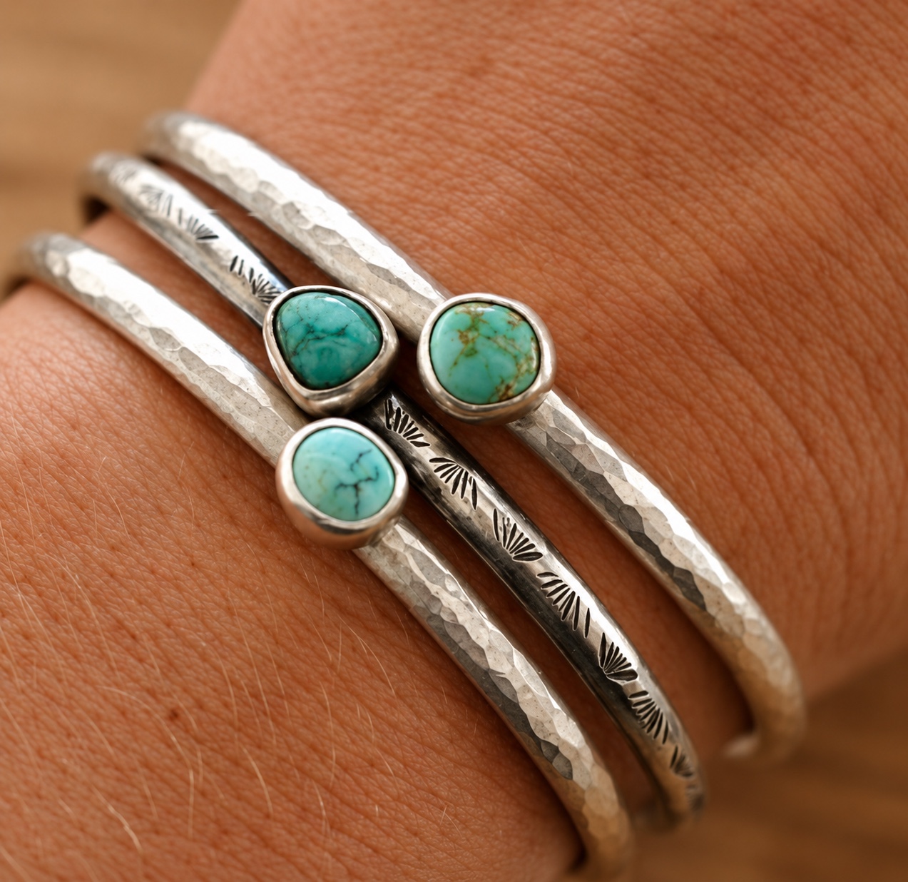 Hand-forged silver cuff bracelets with turquoise stones